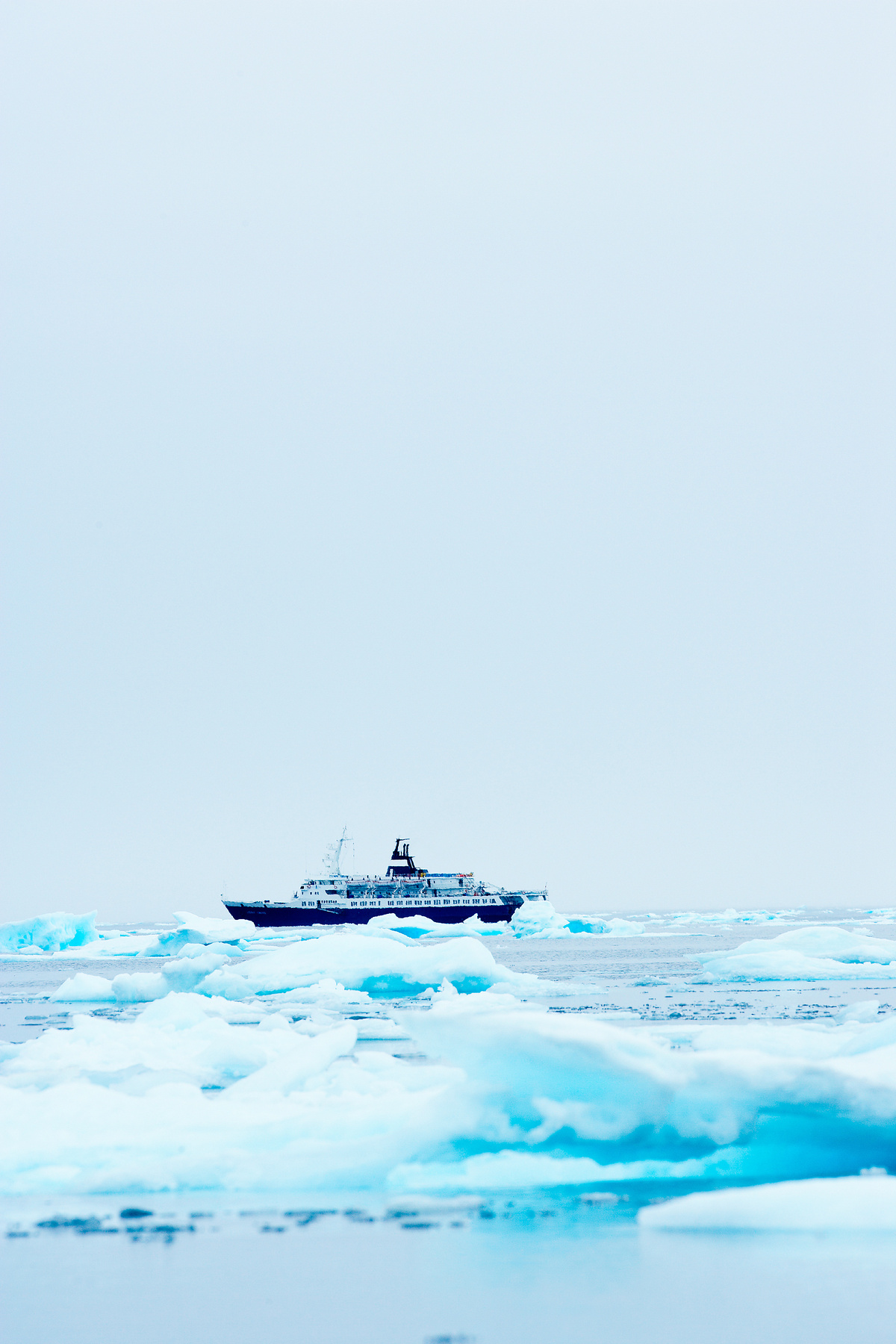 Cruise ship among icebergs